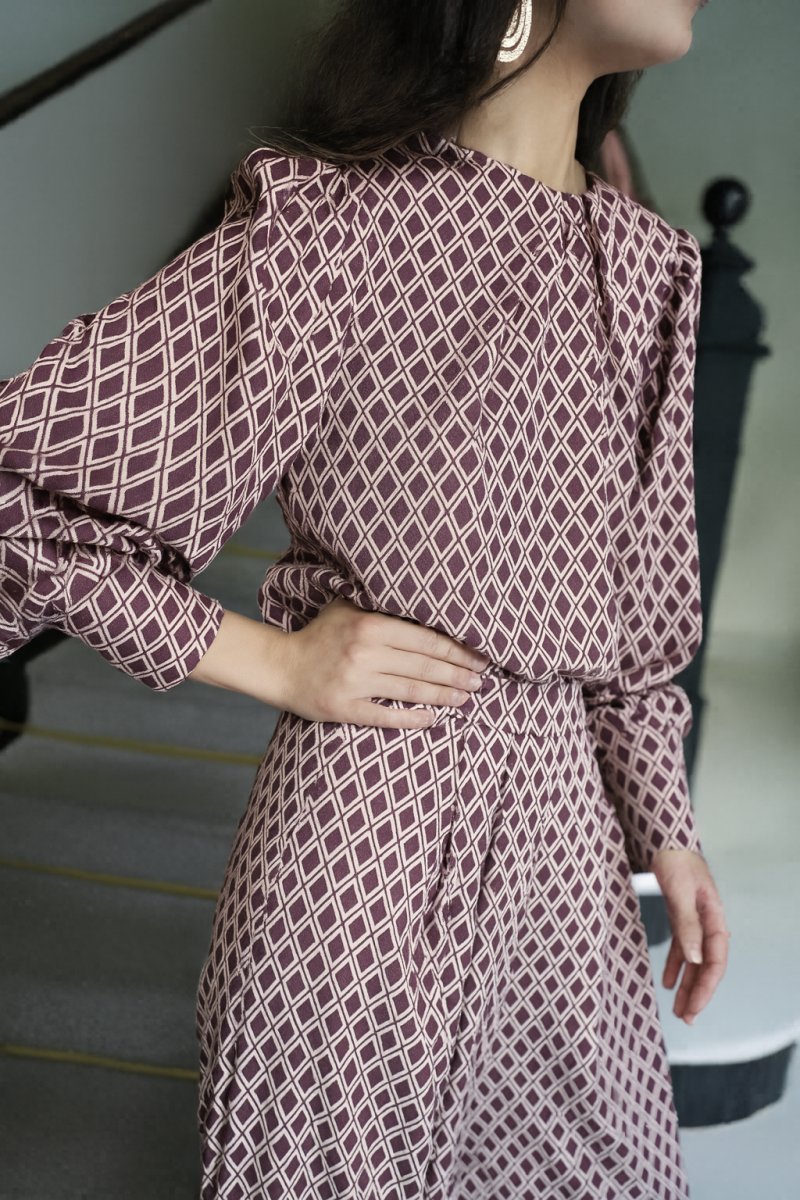 Blusa geométrica botón puño